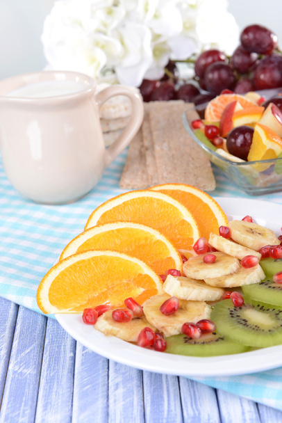 Sweet fresh fruits on plate on table close-up - Фото, зображення
