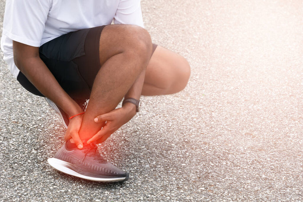 Sore ankle, man injury ankle pain after training running workout, Healthcare Concept - Φωτογραφία, εικόνα