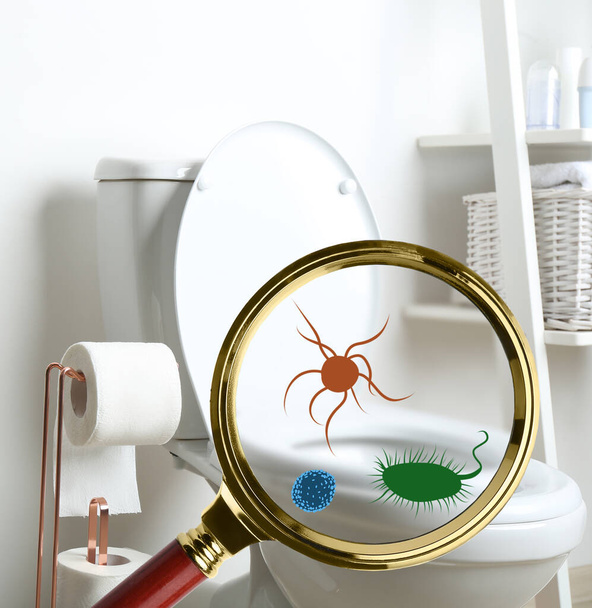Magnifying glass and illustration of microbes on toilet bowl in bathroom - Фото, зображення