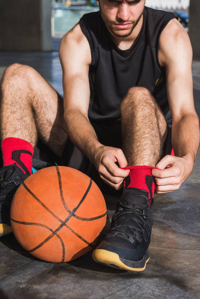 young man getting ready to play basketball - Photo, image