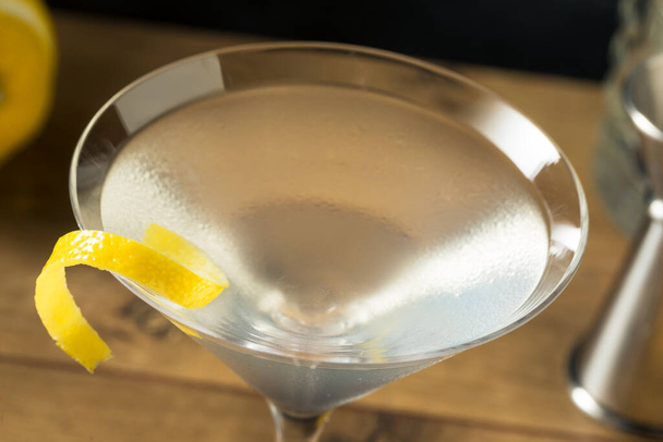 Boozy Refreshing Gin Martini with a Lemon Garnish - Fotó, kép
