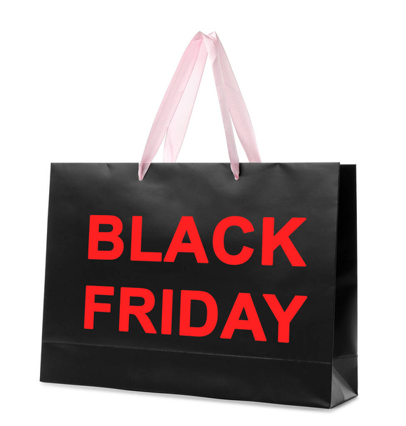 Paper shopping bag with phrase BLACK FRIDAY on white background - Fotó, kép