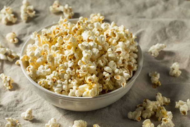 Homemade Salty Buttered Popcorn in a Bowl - 写真・画像