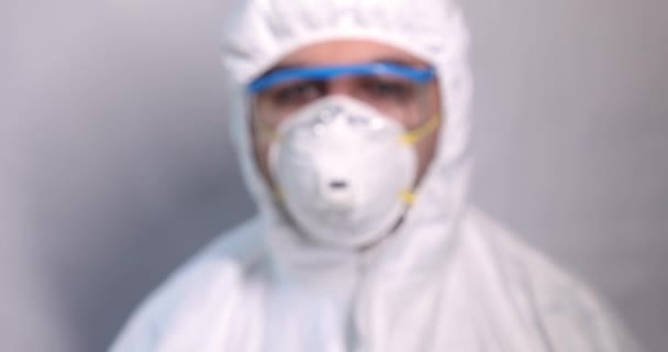 Young man doctor in protective clothes close up - Materiaali, video