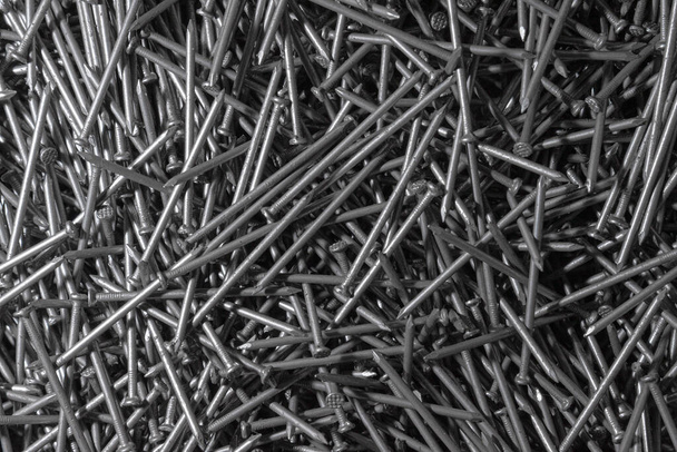 Metal Nails. Texture. Many new long iron nails. Background for wallpaper. - Fotografie, Obrázek