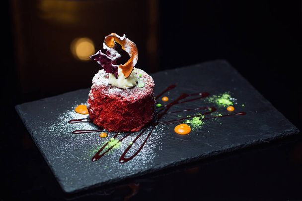 Sweet dessert on a black background - Фото, зображення