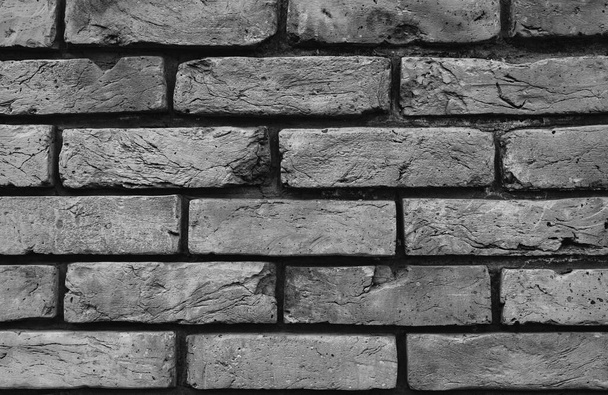 Brick wall background. Old brick. Background or wallpaper. Texture. Close-up. Black and white photo. - Photo, Image