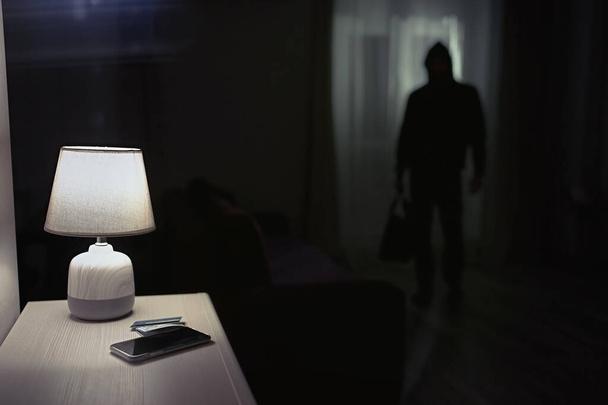                            Burglar inside of a house with flashlight              - Photo, image