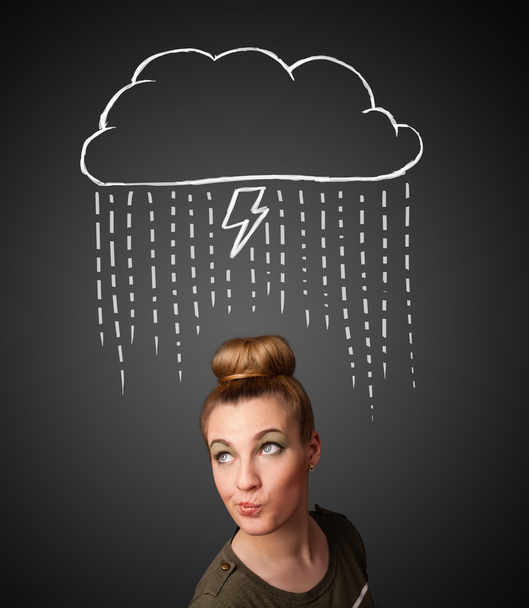 Young woman with thundercloud above her head - 写真・画像