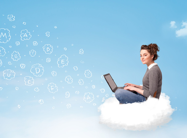 Young woman sitting in cloud with laptop - Foto, Imagem