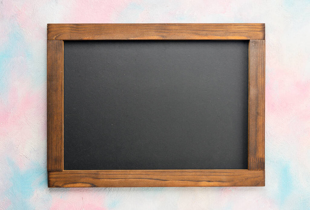 Chalk board on bright colored background - Foto, afbeelding