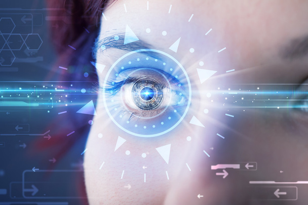 Cyber girl with technolgy eye looking into blue iris - Foto, Imagem
