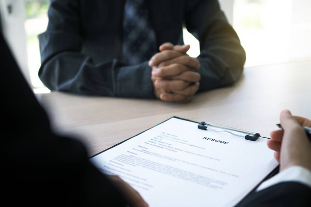 Executives are interviewing candidates. Focusing on resume writing tips, applicant qualifications, interview skills and pre-interview preparation. Considerations for new employees - Photo, Image