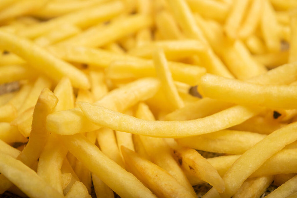 French fries scattered surface texture. Close up - Photo, Image
