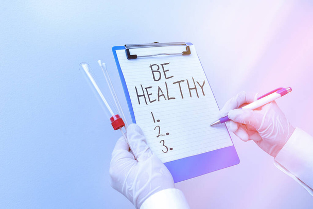 Handwriting text Be Healthy. Concept meaning promote a state of complete emotional and physical wellbeing Laboratory blood test sample shown for medical diagnostic analysis result. - Photo, Image