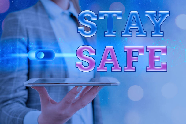 Text sign showing Stay Safe. Conceptual photo secure from threat of danger, harm or place to keep articles Graphics padlock for web data information security application system. - Photo, Image