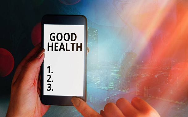 Handwriting text Good Health. Concept meaning state of being vigorous and free from a bodily or mental disease Modern gadgets with white display screen under colorful bokeh background. - Photo, Image
