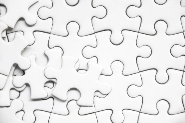 white jigsaw puzzle background. - Photo, image