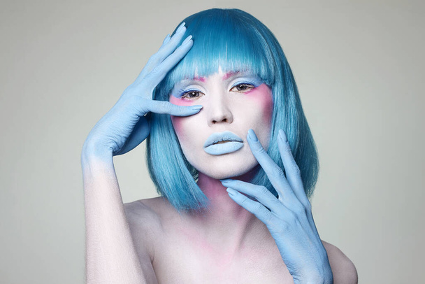 Beautiful girl with Blue Hair, hands and art make-up. Fairy beauty young woman - Фото, изображение