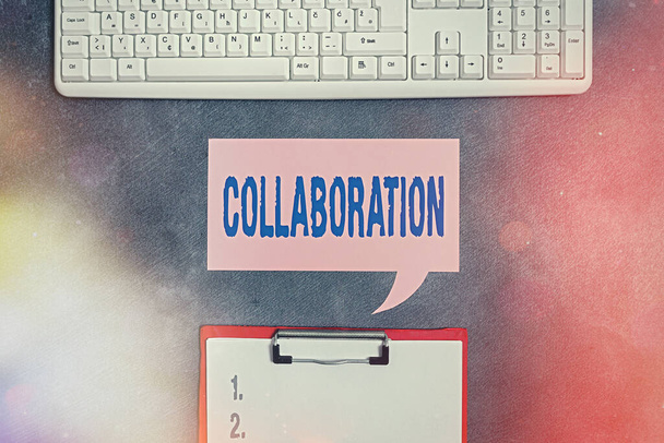 Text sign showing Collaboration. Conceptual photo process of two or more showing working together to achieve a goal Paper accesories with digital smartphone arranged on different background. - Photo, Image