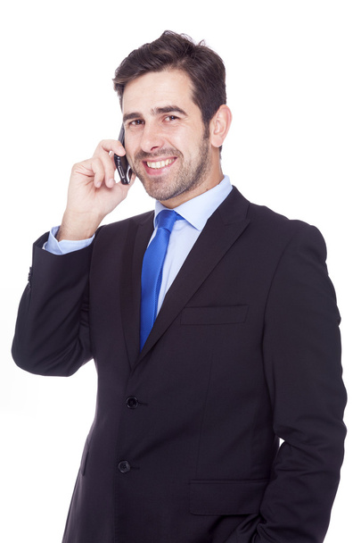 Handsome business man talking on the phone, isolated on a white - Zdjęcie, obraz