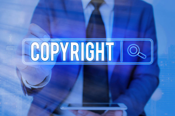 Writing note showing Copyright. Business photo showcasing exclusive legal right to print write perform film record literary Web search digital information futuristic technology network connection. - Photo, Image