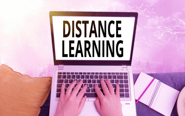 Conceptual hand writing showing Distance Learning. Business photo text educational lectures broadcasted over the Internet remotely Modern gadgets white screen under colorful bokeh background. - Photo, Image