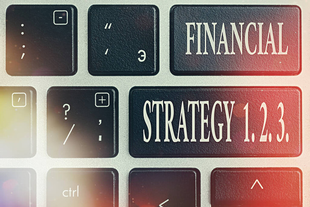 Text sign showing Financial Strategy 1 2. 3.. Conceptual photo build on insights from a business context Pc keyboard key with empty note paper above background copy space. - Photo, Image