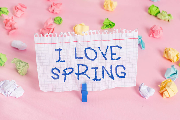 Conceptual hand writing showing I Love Spring. Business photo showcasing telling why having a strong affection to this season Colored crumpled papers empty reminder pink floor clothespin. - Фото, изображение