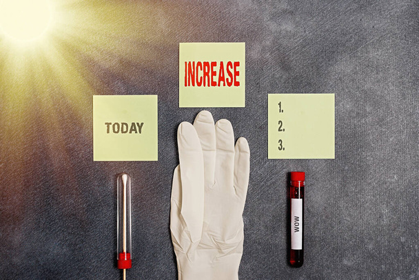 Word writing text Increase. Business concept for the act of getting bigger or better or of making something bigger Extracted blood sample vial with medical accessories ready for examination. - Photo, Image