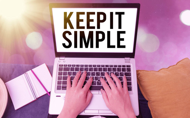 Conceptual hand writing showing Keep It Simple. Business photo showcasing ask something easy understand not go into too much detail Modern gadgets white screen under colorful bokeh background. - Photo, Image