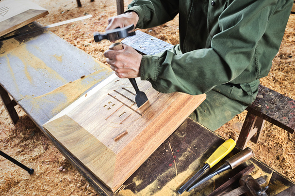 Worker carving wood - Фото, зображення