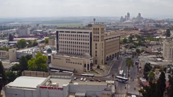 Ramleh, Israel - June 20, 2020: View of government ministry building in the center of city, aerial drone view 4k - Felvétel, videó