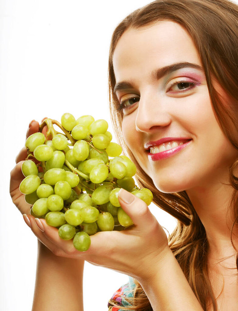 portrait of a girl with a bunch of grapes isolated on white background - Zdjęcie, obraz