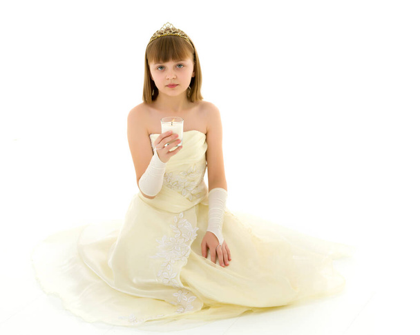 Little girl in a New Year costume with a candle. - Foto, Bild