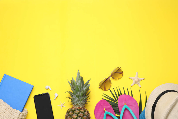 Beach accessories on yellow background, flat lay. Space for text - Fotoğraf, Görsel