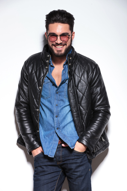 man in leather jacket smiling to the camera - Photo, Image