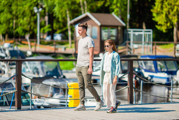 Young father and little girl in port at summer - Foto, imagen