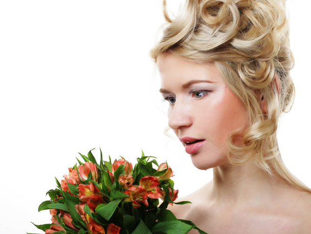 Beautiful blond girl with flowers on a white background. - Foto, Imagen