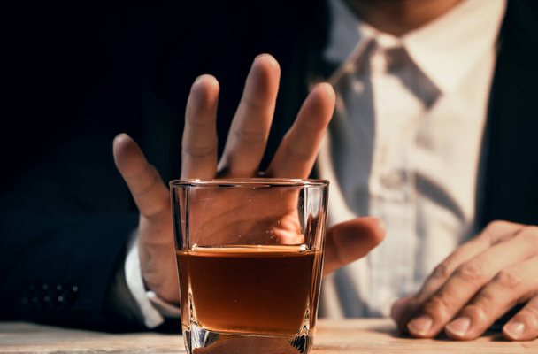Closeup businessmen holding a glass of whiskey - Fotoğraf, Görsel