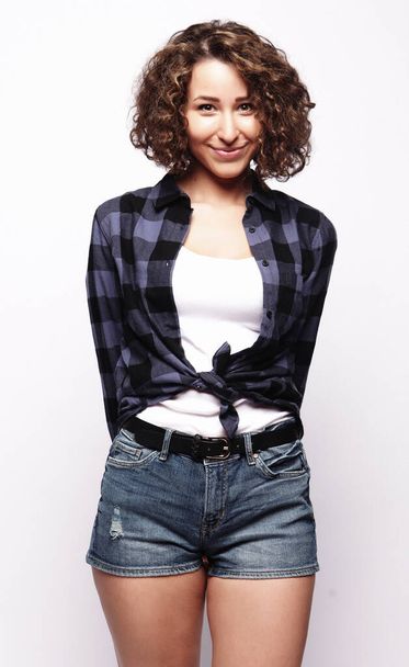 lifestyle and people concept:Young happy woman with curly hair - Photo, Image
