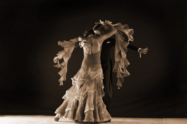 dancers in ballroom against on black background - Foto, Imagen