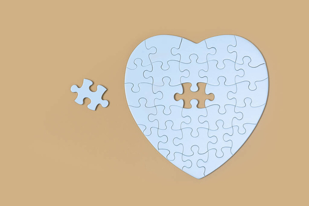 Unfinished white jigsaw puzzle pieces on Yellow  background, The last piece of jigsaw puzzle, Copy space. - Foto, Imagem