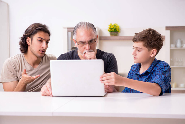 Grandfather learning new technology from son and grandson - Photo, Image