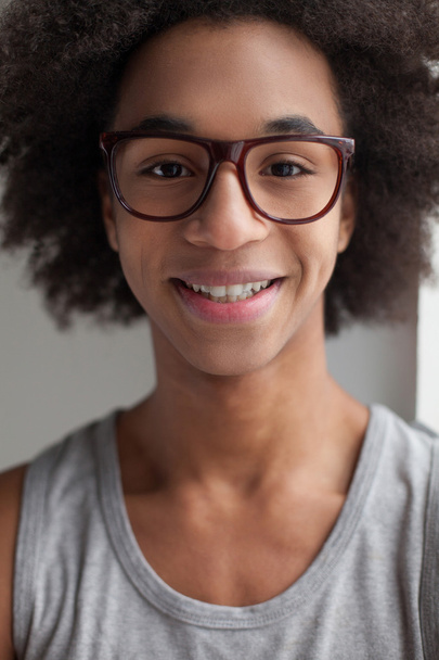 Cheerful teenage African boy in glasses - Fotografie, Obrázek