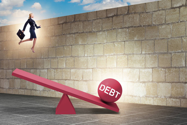 Debt and loan concept with businesswoman and seesaw - Photo, Image