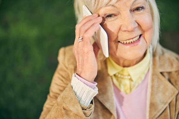Good looking Caucasian old woman answering call - Foto, Imagem