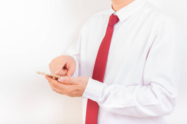 Smartphone, man in white suit with red necktie using new smartphone with white background - Valokuva, kuva