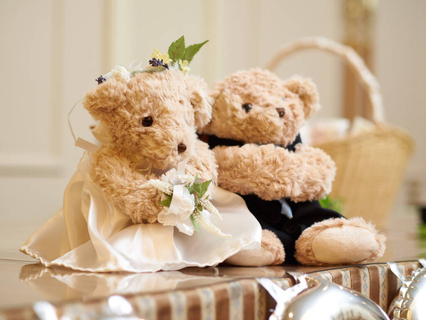 A plush toy in the shape of the bride and groom at the wedding reception - Photo, Image
