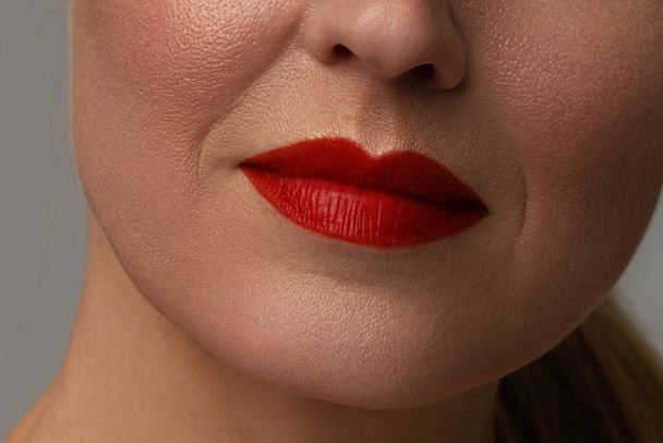 Close-up of full lips of mature woman with wrinkles. anti aging skin care program. Injections and lifting - Foto, Imagen